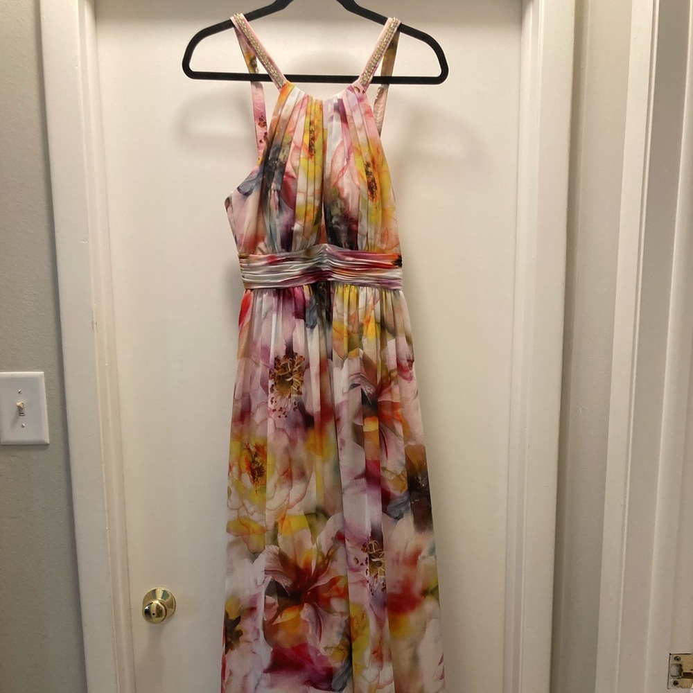 Floor length evening gown with cut out bust detail